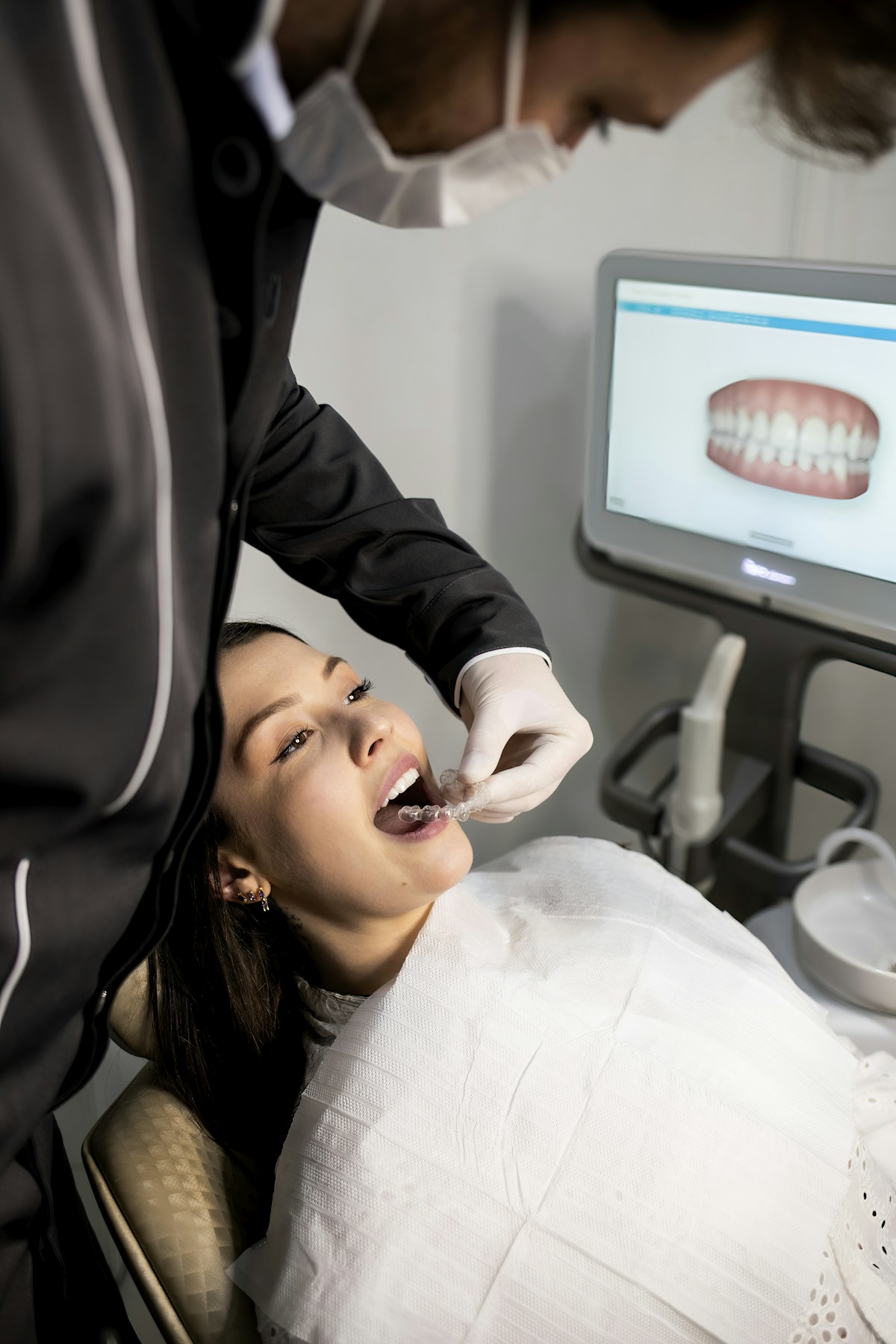 Patient showing clear aligner tray